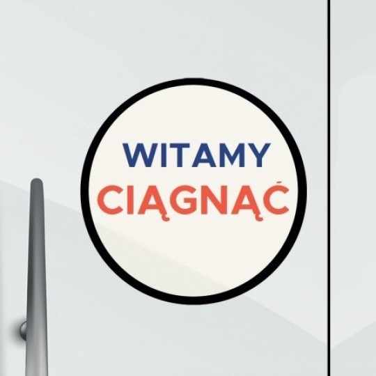 Okrągłą naklejka na szklanych drzwiach z napisem Witamy Ciągnąć
