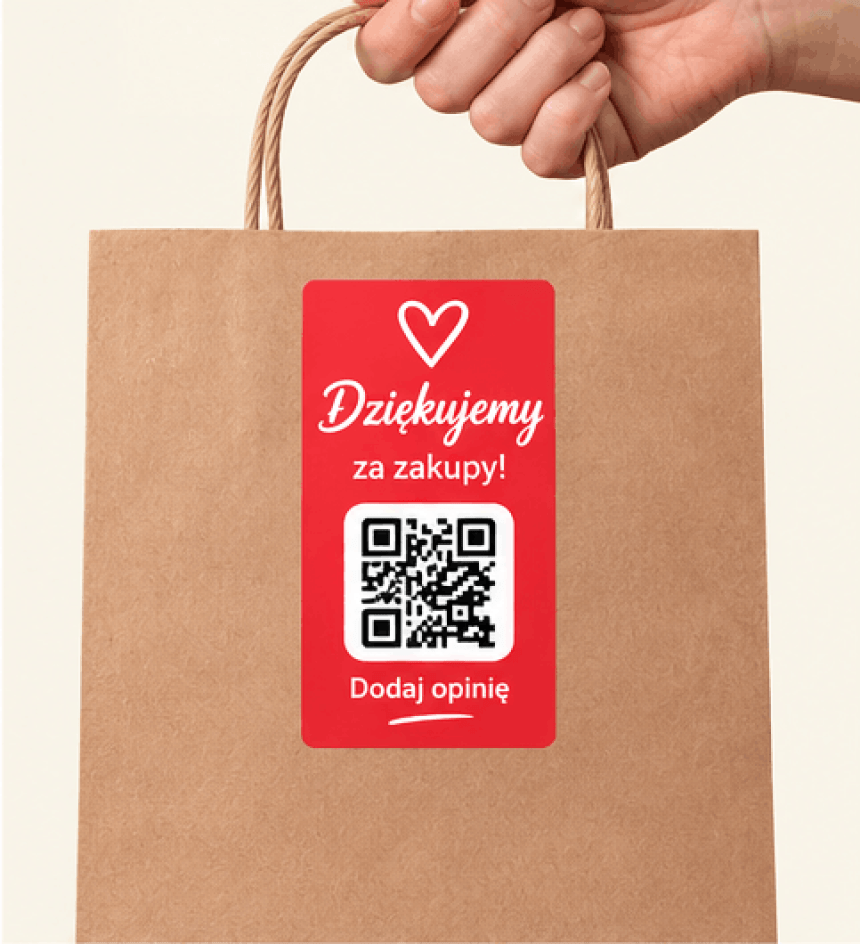 Brązowa torba papierowa z uchem oklejona czerwoną naklejką z sercem, napisem „Dziękujemy za zakupy!”, kodem QR i hasłem „Dodaj opinię”