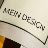 Kremowa etykieta z napisem Mein Design