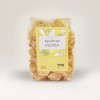Plastikowa paczka kandyzowanego imbiru z żółto-białą prostokątną naklejką