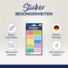 Obrazek przedstawia zestaw naklejek projektowych w różnych kolorach, oznaczonych jako nadające się do pisania markerami, bezpieczne w kuchence mikrofalowej i zmywarce. Podkreśla, że produkt jest wyprodukowany w Niemczech.
